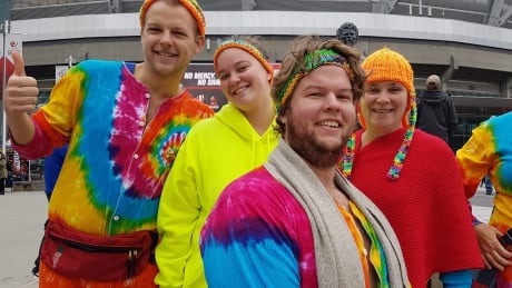 Some rugby sevens fans sporting tie dye fashion pose before entering BC Place. 7s fans