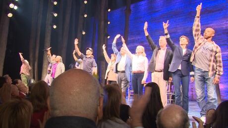 The cast of Come From Away take a bow towards a standing audience at the Gerald Schoenfeld Theatre on opening night. Come From Away cast