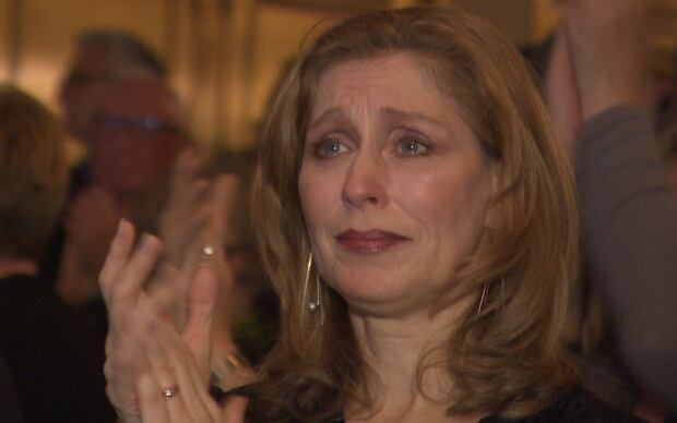 Woman crying at finale of Come From Away
