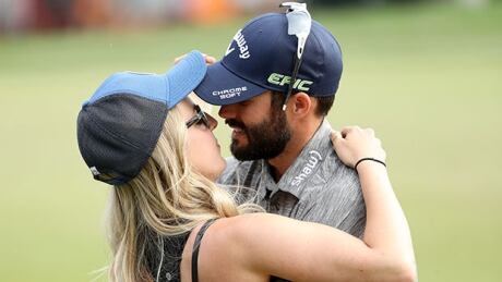PALM HARBOR, FL - MARCH 12: Adam Hadwin of Canada celebrates with fiancee Jessica Dawn on the 18th green after winning the Valspar Championship during the final round at Innisbrook Resort Copperhead Course on March 12, 2017 in Palm Harbor, Florida. Hadwin won with a score of -14. (Photo by Mike Lawrie/Getty Images) hadwins-170312-1180