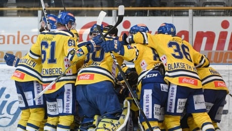Storhamar players celebrate after Joakim Jensen's goal in the eighth overtime Sunday ended their eight hour, 30-minute 2-1 win over Sparta. Norway Longest Hockey Game