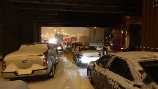 Cars wait for help on Highway 13.