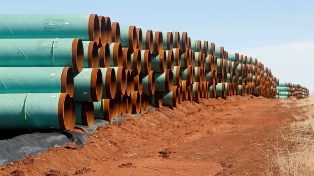 Pipe ready to become part of the Keystone Pipeline are stacked in a field near Ripley Okla. in this Feb. 2012
