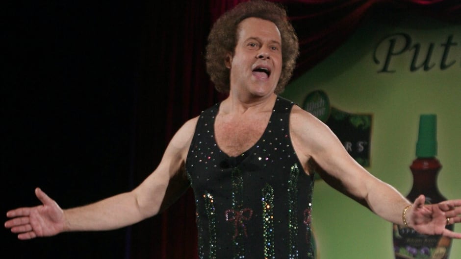 June 2, 2006 - Richard Simmons speaks to the audience before the start of a summer salad fashion show. (AP Photo/Tina Fineberg, File)