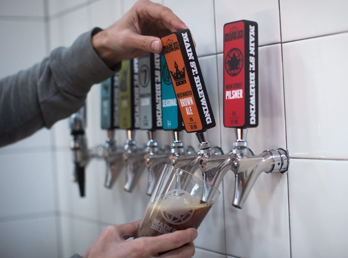 beer taps on a white wall