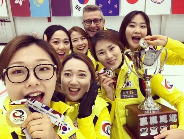 Peter Gallant of P.E.I. with his South Korea women's curling team
