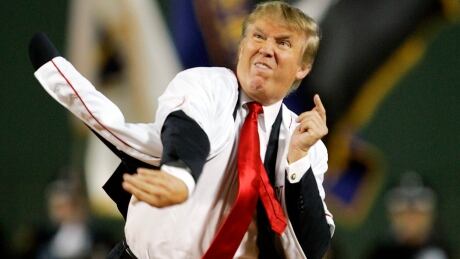 Donald Trump throws out the ceremonial first pitch before the start of the game between the Boston Red Sox and the New York Yankees in 2006. YANKEES RED SOX BASEBALL