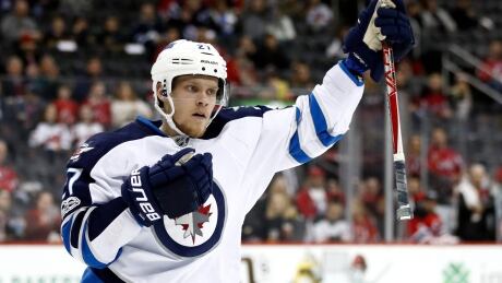 Winnipeg Jets left wing Nikolaj Ehlers celebrates after scoring against the New Jersey Devils during the Jets' 4-3 shootout win. jets-devils