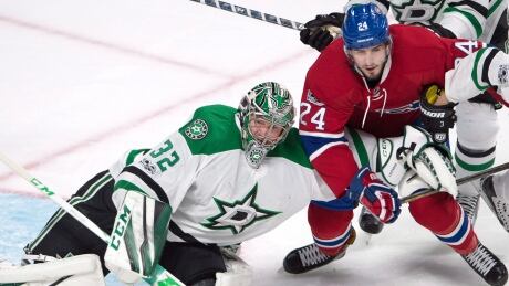 Montreal's Phillip Danault (24) is blocked by Dallas Stars goalie Kari Lehtonen (32) during the Canadiens' 4-1 win Tuesday. stars-canadiens