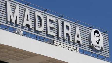 An image of Cristiano Ronaldo sits next to the Madeira airport sign at the Madeira international airport outside Funchal, the capital of Madeira island, Portugal, Wednesday March 29, 2017. Madeira International Airport has be renamed after local soccer star Cristiano Ronaldo on Wednesday during a ceremony, with family at the airport outside his Funchal hometown. Portugal Cristiano Ronaldo Airport