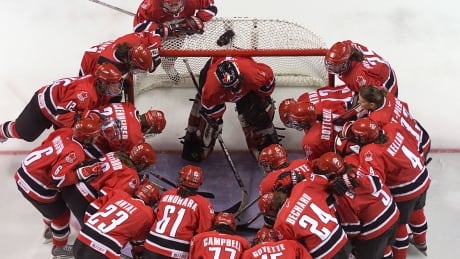 13 Feb 2002: The Canadian women's hockey team gathers around goalie Sami Jo Small #1 at the net before their game against Russia during the preliminary round during the Salt Lake City 2002 Winter Olympics at the E Center in West Valley City, Utah. DIGITAL IMAGE Mandatory Credit: Brian Bahr/Getty Images small-sami-jo-1180