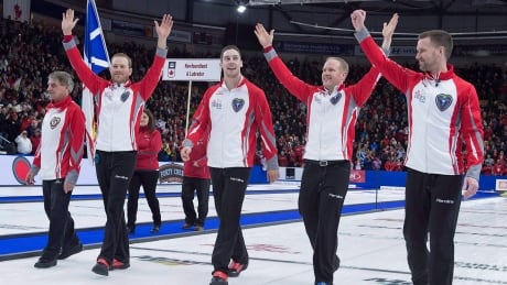 Newfoundland and Labrador's Brad Gushue, Mark Nichols, Brett Gallant, Geoff Walker and coach Jules Owchar, right to left, head down the rink after winning the Tim Hortons Brier curling championship in St. John's on Sunday, March 12. CUR BRIER 20170312