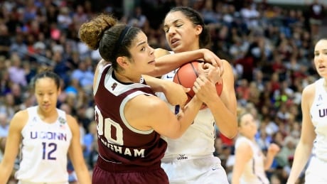 UConn fought back to tie the game before a buzzer-beating shot from Mississippi State's Morgan William at the end of overtime denied the Huskies of a fifth straight national championship appearance and their record 112th straight win. uconn-huskies