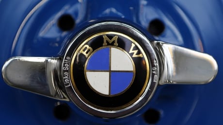 FILE - This March 7, 2016 file photo shows the logo of German car manufacturer BMW in Munich, Germany. BMW is recalling more than 230,000 cars and SUVs in the U.S. to replace potentially dangerous Takata air bag inflators announced Friday, Feb. 3, 2017. The recall covers certain 3 series cars from 2000 to 2002, some 5 series cars from 2001 to 2002, and some X5 SUVs from 2001 to 2003. (AP Photo/Matthias Schrader) BMW Air Bag Recall
