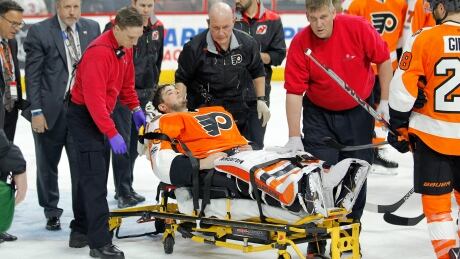 Philadelphia Flyers goalie Michal Neuvirth was taken off the ice on a stretcher after collapsing early in the first period of the team's NHL hockey game against the New Jersey Devils. michal-neuvirth