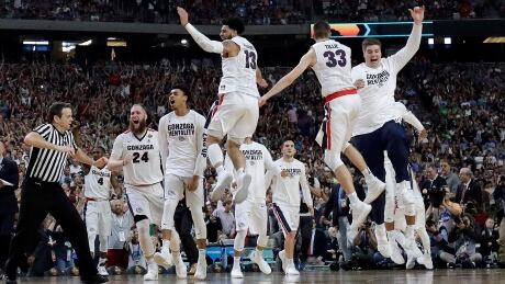 Gonzaga players celebrate after the semifinals of the Final Four NCAA college basketball tournament against South Carolina. gonzaga-south-carolina