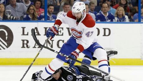 Montreal Canadiens right wing Alexander Radulov (47) gets by as Tampa Bay Lightning defenceman Jake Dotchin (59) loses his stick during the first period. canadiens-lightning