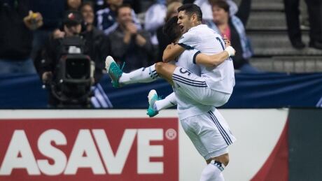 Fredy Montero, left, and Matias Laba scored one minute apart in the second half to give Vancouver the lead for good. matias-laba