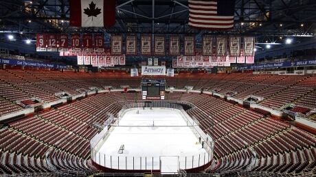 FILE - In this Dec. 18, 2012, championship banners and retired numbers of the Detroit Red Wings hockey team hang from the rafters above the ice at Joe Louis Arena in Detroit. The Lions, Tigers and Red Wings have had little trouble drawing fans despite the economic downturn in Detroit, so don't expect those franchises to crumble in light of the city's bankruptcy filing. But there are questions to answer, especially for the Red Wings, who are hoping to move from Joe Louis Arena into a new downtown facility that team and city officials announced plans for last month. (AP Photo/Paul Sancya, File) joe-louis-arena-inside-1180