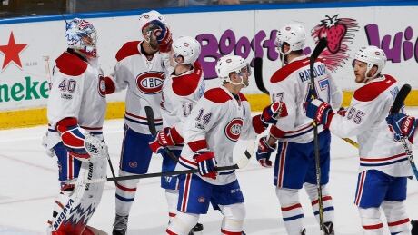 Montreal Canadiens goaltender Charlie Lindgren (40) is congratulated by teammates after defeating the Florida Panthers 4-1 on Monday, clinching the Atlantic division. canadiens-montreal