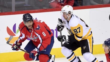Washington Capitals left wing Alex Ovechkin (8), of Russia, skates ahead of Pittsburgh Penguins center Sidney Crosby (87) during the second period of an NHL hockey game, Wednesday, Jan. 11, 2017, in Washington. Penguins Capitals Hockey