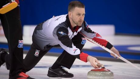 Canada skip Brad Gushue makes a shot during the 10th draw against China at the men's world curling championships in Edmonton. gushue-brad