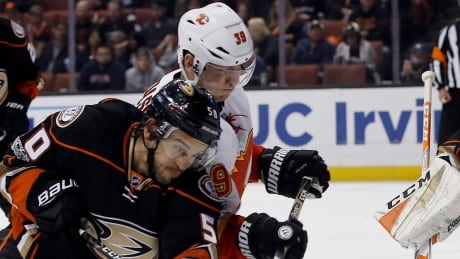 Anaheim Ducks centre Antoine Vermette vies for the puck with Calgary Flames right wing Alex Chiasson on a deflection by Ducks goalie John Gibson during Tuesday's 3-1 Anaheim win. Flames Ducks Hockey