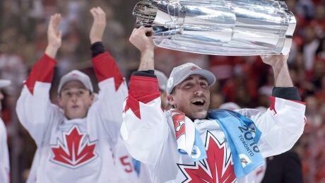 Canada's Brad Marchand (63) hoists the cup as teammate Jonathan Toews applauds after defeating Europe in World Cup of Hockey finals action in Toronto on Thursday, September 29, 2016. The mother of Marchand, a Nova Scotia-born NHL player poised to make a bid to join Team Canada, says the league's decision to pass on the Olympics is a deep disappointment. THE CANADIAN PRESS/Frank Gunn HKN OLY Marchand 20170405