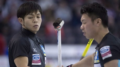 Japan skip Yusuke Morozumi and lead Kosuke Morozumi react to a shot during the 10th draw against Norway at the Men's World Curling Championships in Edmonton, Tuesday, April 4, 2017. THE CANADIAN PRESS/Jonathan Hayward morozumis-170404-1180