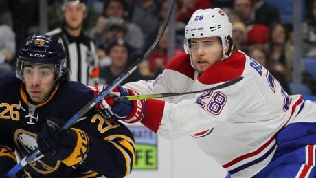 Buffalo Sabres forward Matt Moulson (26) and Montreal Canadiens defenceman Nathan Beaylieu (28) battle for position during the first period. canadiens-sabres