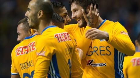 Tigres' Andre-Pierre Gignac, right, celebrates with teammates after scoring against the Vancouver Whitecaps during the second leg of the CONCACAF Champions League semifinal match in Vancouver on Wednesday. tigres-whitecaps-040517-620