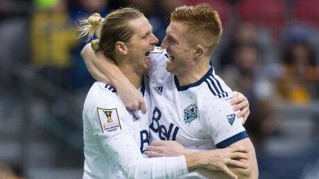 Vancouver Whitecaps' Brek Shea, left, and Tim Parker celebrate Shea's goal during first half, second leg, CONCACAF Champions League soccer semifinal action against Tigres UANL, in Vancouver, B.C., on Wednesday, April 5, 2017. THE CANADIAN PRESS/Darryl Dyck brek-shea