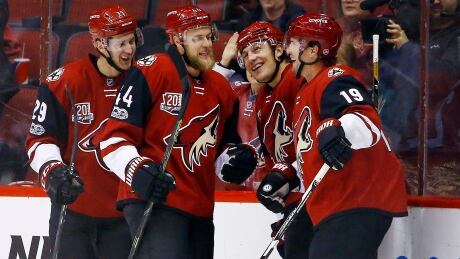 The Arizona Coyotes scored three goals in the second period as they held on to defeat the Vancouver Canucks 4-3 on Thursday night. arizona-coyotes