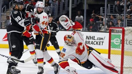 Calgary Flames goalie Jon Gillies stretches to protect the goal during the second period in Los Angeles on Thursday. flames-kings-040617-620