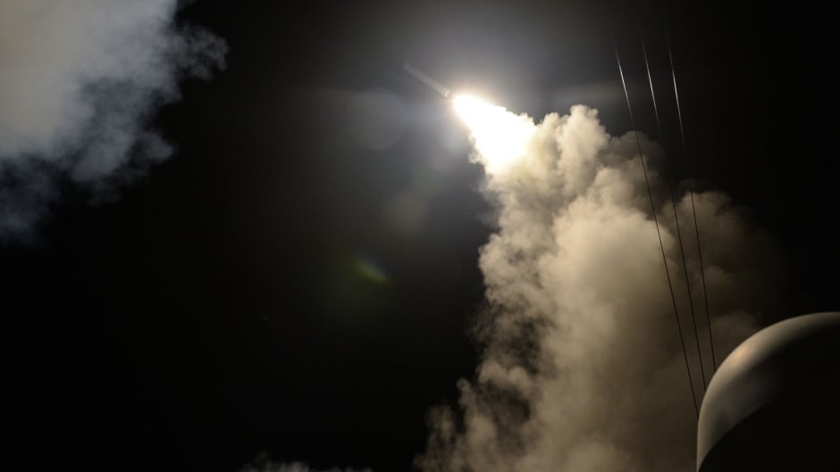 A handout photo made available by the US Navy Office of Information shows the guided-missile destroyer USS Porter (DDG 78) launching a missile strike while in the Mediterranean Sea, April 7, 2017. The United States military launched at least 50 tomahawk cruise missiles against al-Shayrat military airfield near Homs, Syria, in response to the Syrian military's alleged use of chemical weapons in an airstrike in a rebel held area in Idlib province on April 4, 2017.