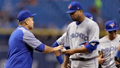 Toronto Blue Jays starting pitcher Francisco Liriano, right, hands the ball to manager John Gibbons as he is taken out in the first inning against the Tampa Bay Rays on Friday in St. Petersburg, Fla. blue-jays-040717-620