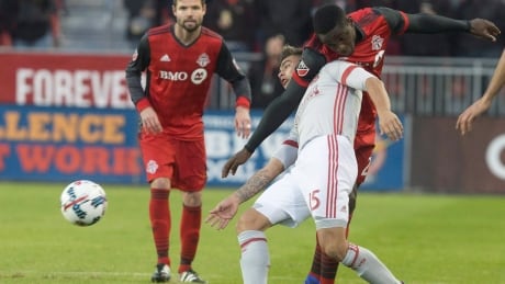 Chris Mavinga of Toronto FC battles Hector Villalba of Atlanta United during Saturday MLS action in Toronto. TFC-ATL-08042017