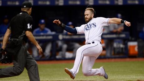 Evan Longoria of the Rays scores on a Steven Souza Jr. single during Tampa's 3-2 extra inning win over the Toronto Blue Jays on Saturday in St. Petersburg, Fla. Jays-Rays-08042017