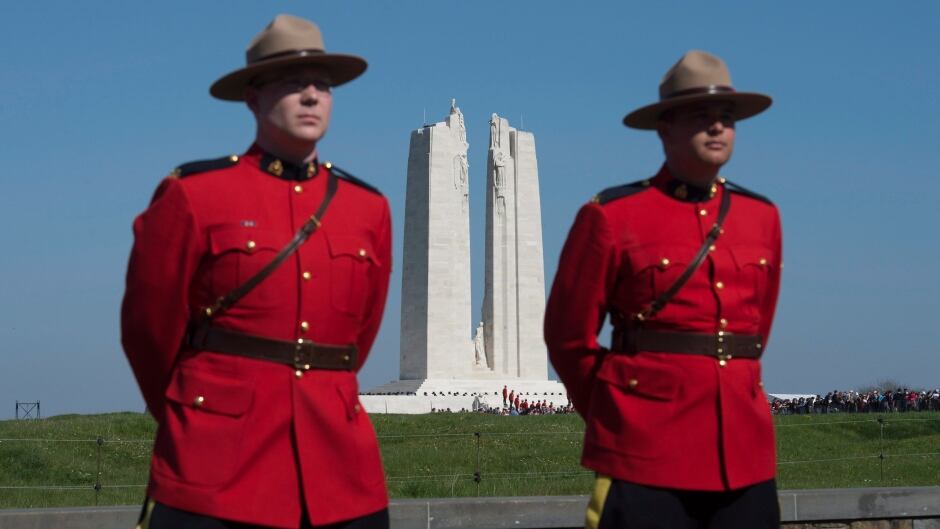 RCMP officers stand at the entrance to the National Vimy Memorial in France before ceremonies to mark the 100th anniversary of the battle on Sunday.