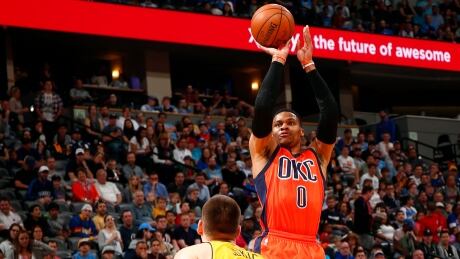 Russell Westbrook, right, of the Oklahoma City Thunder, seen shooting over Denver Nuggets forward Nikola Jokic, recorded his 42nd triple-double on Sunday, setting a new NBA season record. Westbrook-Russell-09042017