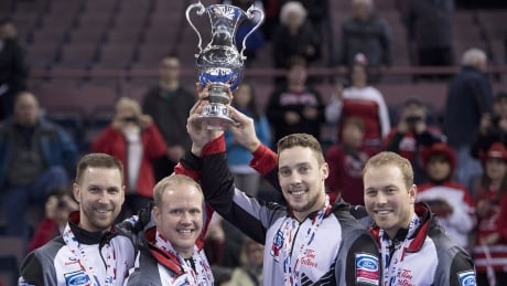 Canada skip Brad Gushue celebrates his gold medal win over Sweden with third, Mark Nichols, second, Brett Gallant and lead, Geoff Walker at the Men's World Curling Championships in Edmonton, Sunday, April 9, 2017. THE CANADIAN PRESS/Jonathan Hayward gushue-team-trophy-170409-1180