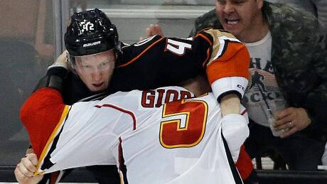 Calgary's Mark Giordano fights Anaheim's Josh Manson during a game on Tuesday after a Giordano hit left Ducks defenceman Cam Fowler injured. Flames Ducks Hockey