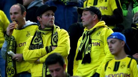 Soccer fans are concerned of the bomb attack to the bus of Borussia Dortmund prior to the UEFA Champions League quarter-final match against AS Monaco Tuesday in Dortmund, Germany. 95309068