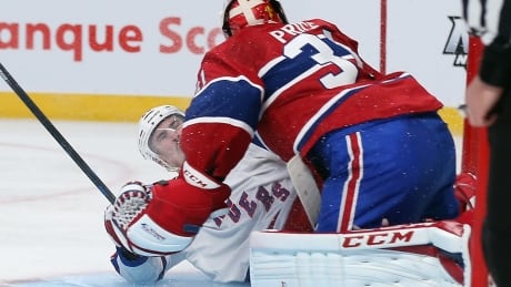 The Rangers' Chris Kreider collides with Montreal's Carey Price during their first-round playoff series in 2014. Price was injured on the play and did not return as the Rangers won in six games. 19-May-14_491722427BB00003_New_York_R