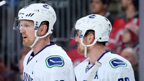 Henrik Sedin (33) and Daniel Sedin (22) of the Vancouver Canucks put up 50 and 44 points, respectively, this season. sedin-brothers