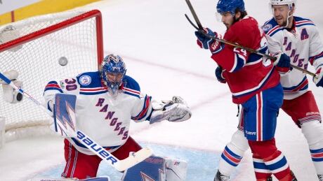 New York Rangers goalie Henrik Lundqvist (30) makes a save on Montreal Canadiens left wing Phillip Danault (24) on Wednesday night. rangers-canadiens