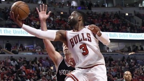 Chicago's Dwyane Wade (3) scores in a 112-73 win over Brooklyn that clinched a playoff spot for the Bulls. Nets Bulls Basketball
