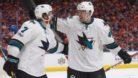 San Jose's Paul Martin, left and Tomas Hertl celebrate after tieing the Oilers en route to a Game 1 win. HKN SHARKS OILERS 20170412