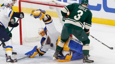 St. Louis goalie Jake Allen, centre, had a busy night against Minnesota, stopping 51 shots in the Blues' Game 1 win. Blues Wild Hockey