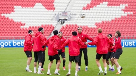 Members of Canada's national men's soccer team practice after the announcement that the Canadian Soccer Association's new primary partnership is with Bell Canada, in Toronto on Wednesday, Oct. 10, 2012. Canada faces Cuba in a World Cup qualifying match in Toronto on Friday. THE CANADIAN PRESS/Nathan Denette canada-soccer-men-1180